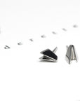 Edgy white gold stud earrings by Bena Jewelry, featuring a geometric minimalist design, displayed on a plain white background custom-crafted in Montreal