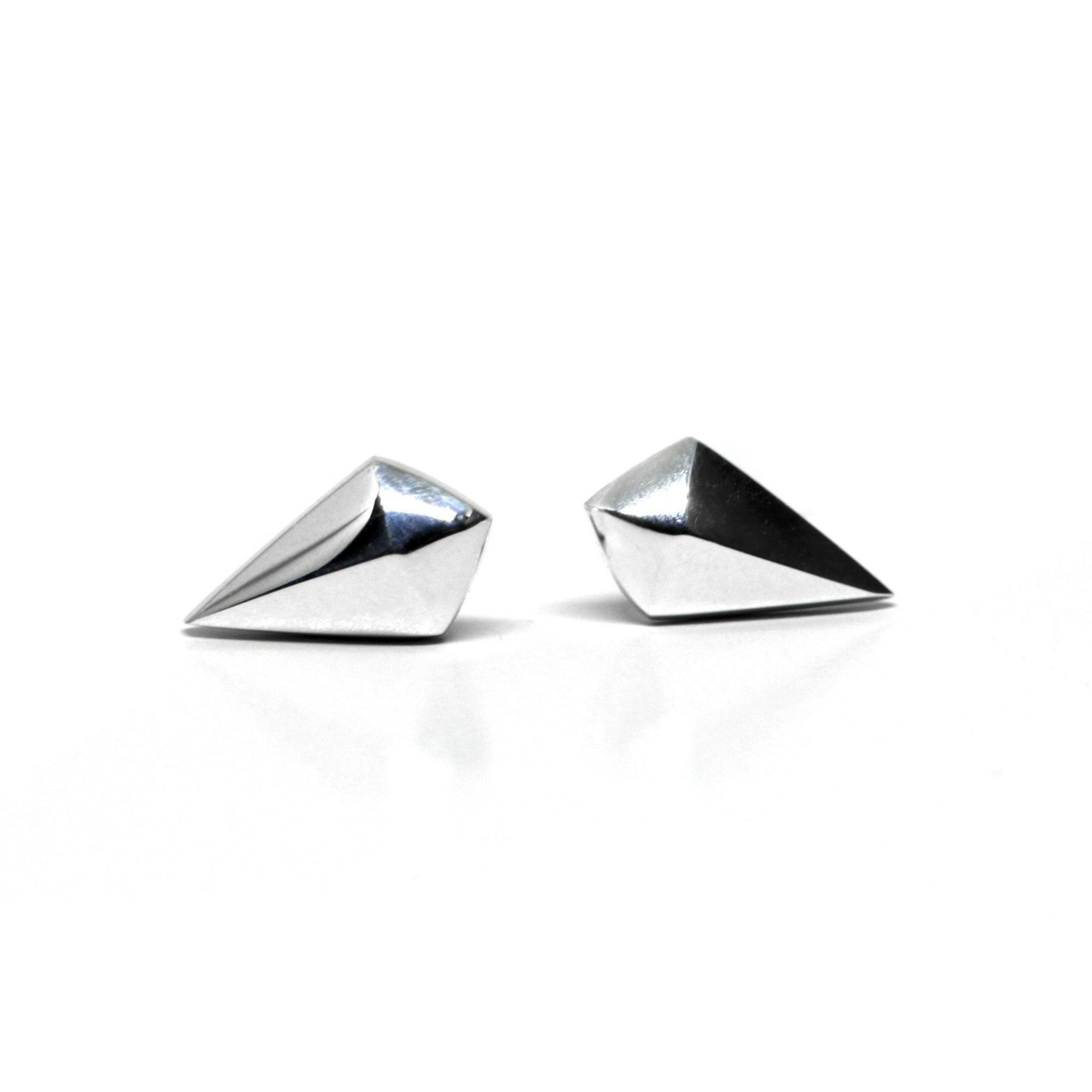 Close-up of Mini Spade Studs – Small and discreet, these solid gold earrings balance simplicity with a subtle edgy touch.