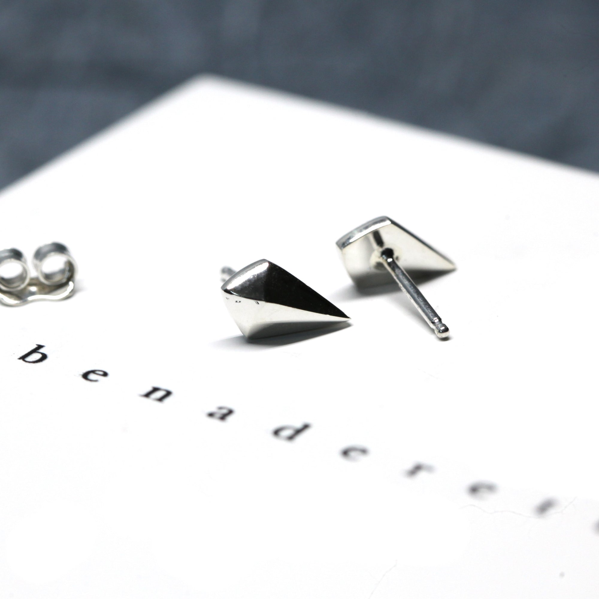 Minimalist Mini-Spade white gold edgy studs, by Bena Jewelry.