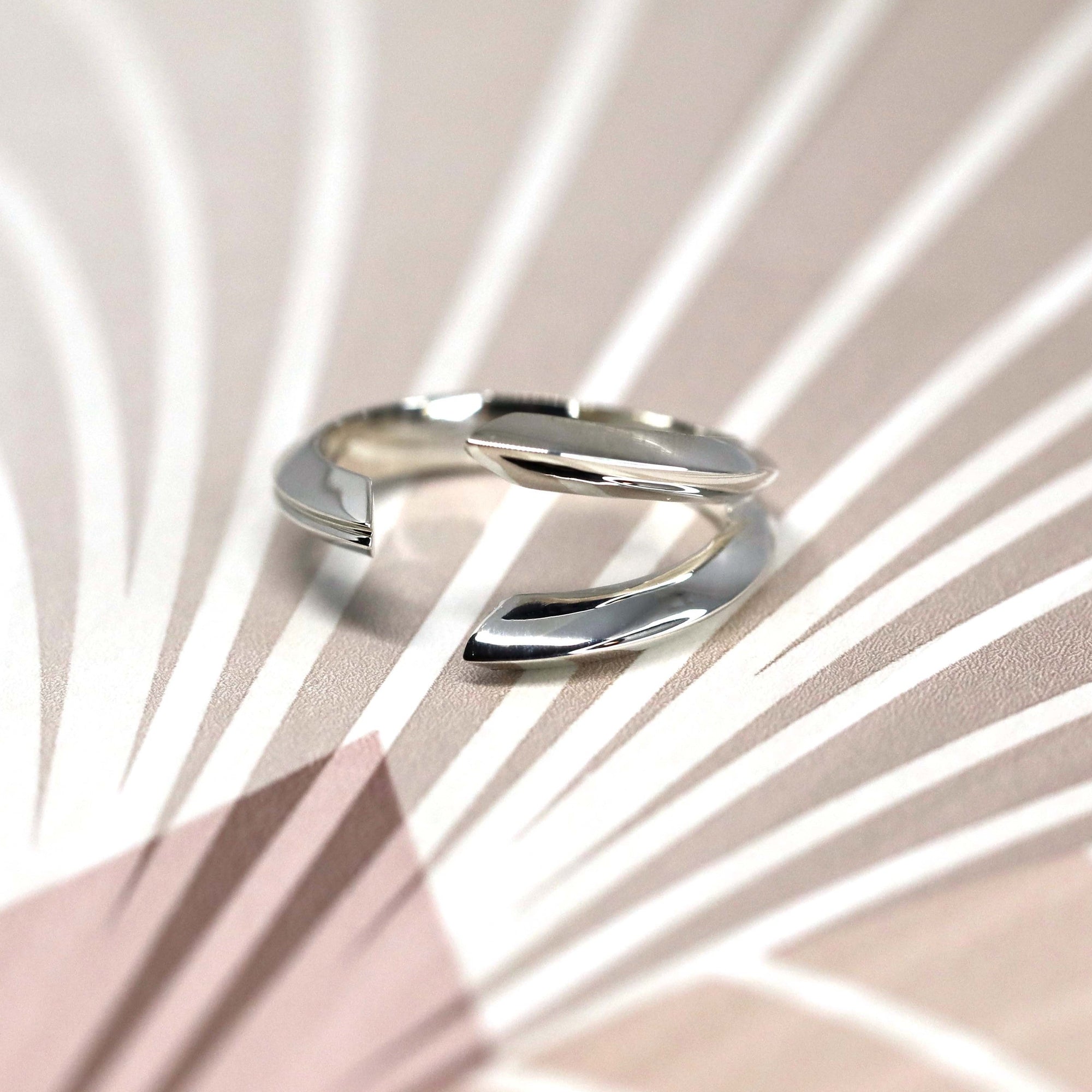 Close-up of Fang Ring in White Gold – A bold, sculptural designer ring with a fang-inspired aesthetic and a high-polish finish.