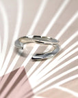Close-up of Fang Ring in White Gold – A bold, sculptural designer ring with a fang-inspired aesthetic and a high-polish finish.