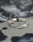 Angled shot of Fang Ring in White Gold – A striking and unique unisex ring, blending minimalism with edgy, modern design.