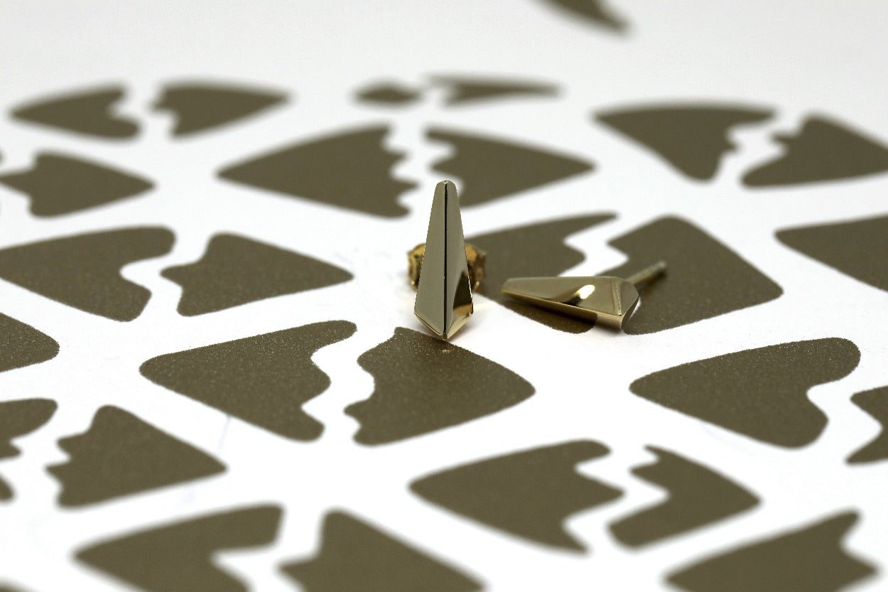 Gold Blade stud earrings, featuring sharp geometric lines for a bold yet refined look. Designed in Montreal, part of Bena Jewelry's contemporary Edgy Collection.