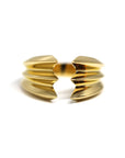 Crush Ring in gold on white background – A bold unisex statement ring with sharp, layered edges, crafted by Bena Jewelry in Montreal.