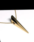 Close-up of the polished surface of the Pike Pendant in Yellow Gold – A high-shine statement jewelry piece with a modern, sculptural design.