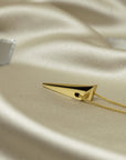 Yellow Gold Pike Pendant displayed on a marble surface – A luxurious fine jewelry piece with an edgy, high-polish finish.