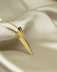 Close-up of Pike Pendant on a jewelry tray – A modern pendant with sharp lines, reflecting light beautifully.