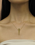 Yellow Gold Pike Pendant layered with other fine jewelry – A striking, modern pendant perfect for layering or wearing solo.