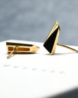 Close-up of Pike Earrings worn on ear – Modern geometric earrings in solid gold, designed for an edgy and elegant look. Handmade in Canada by an independent jewelry designer.