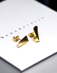 Close-up of Pike Earrings – Bold and contemporary gold earrings with sharp, sculptural lines. Designed by an independent Canadian jewelry artist.
