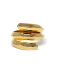 Embrace Ring in yellow gold background – A bold and sculptural unisex gold ring with an edgy, layered design, handcrafted by Bena Jewelry in Montreal.