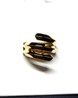 Close-up of Embrace Ring in Yellow Gold – A statement designer ring with a strong geometric structure and high-polish finish.