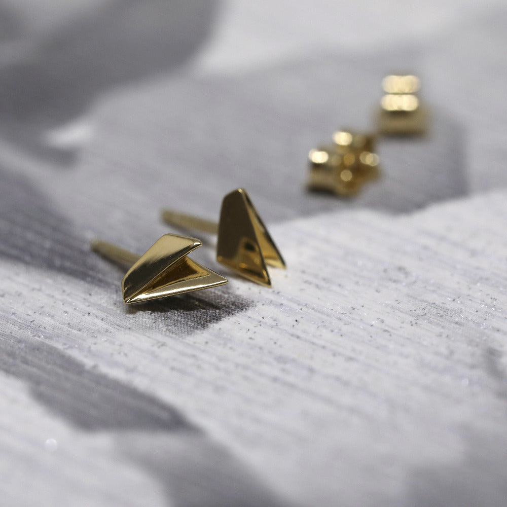 Edges Gold Studs in yellow gold by Bena Jewelry, featuring an edgy minimalist design, photographed on a dark background, modern unisex jewelry crafted in Canada