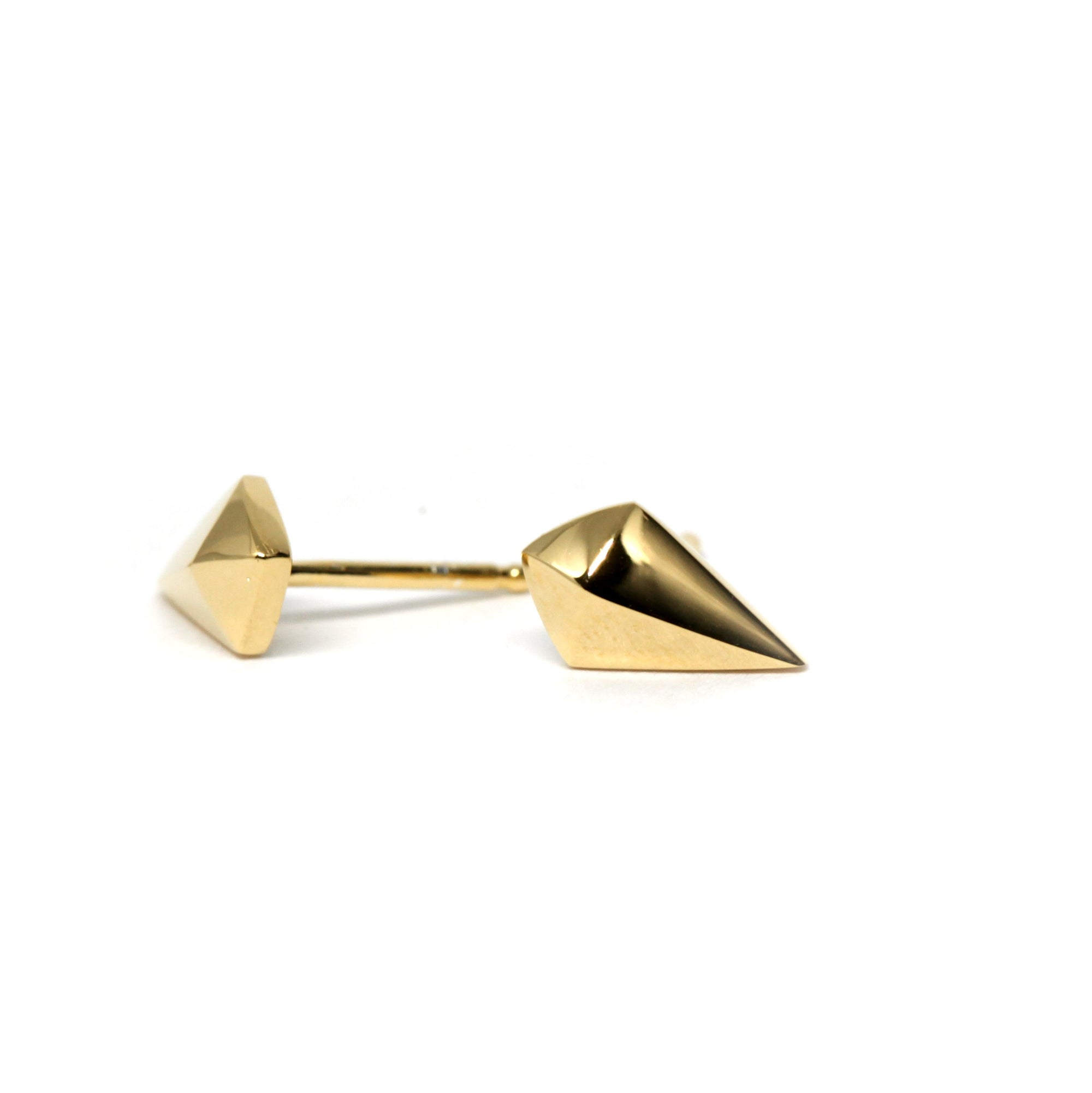 Top-down view of minimalist yellow gold studs – A timeless, geometric design with clean lines, handcrafted with precision.