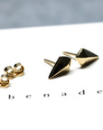 Angled shot of Mini Spade Studs – Unisex and subtle, these gold earrings offer effortless sophistication for any occasion.