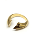 Close-up of Tidal Ring in Yellow Gold – A statement designer ring with a fluid, wave-inspired structure and a high-polish finish.