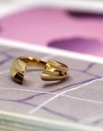 Macro shot of Tidal Ring in Yellow Gold – A highly detailed close-up highlighting the polished curves and craftsmanship.