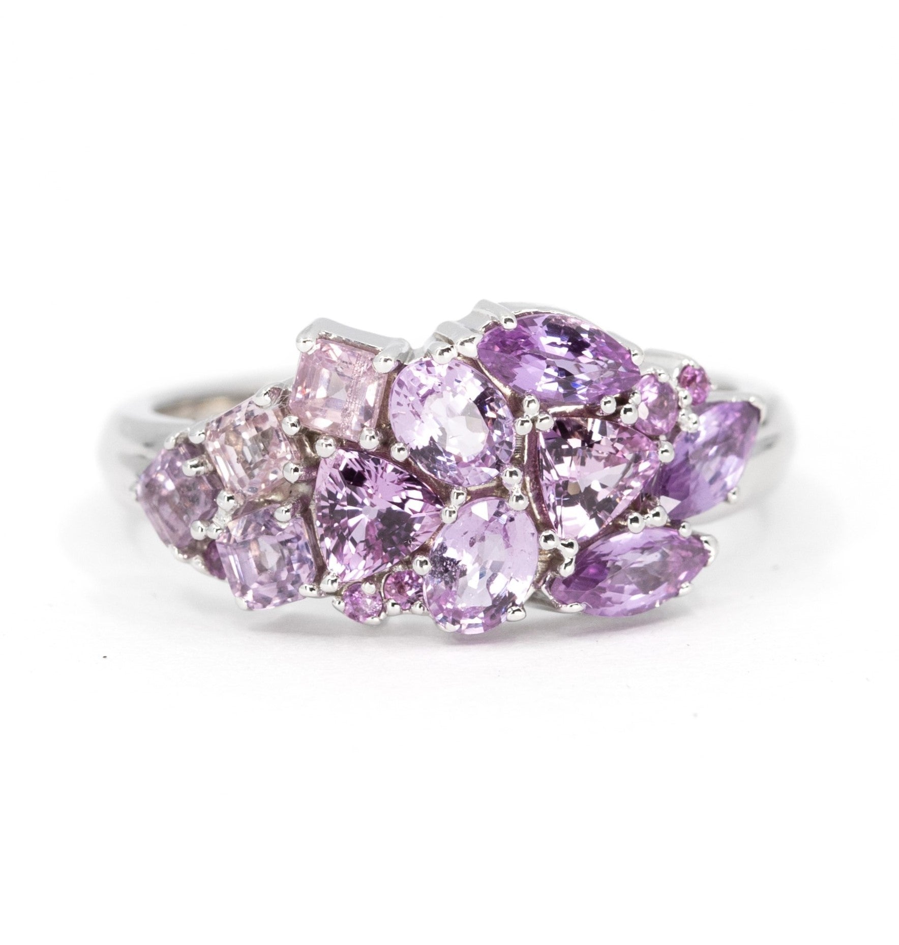 Front view: The Avalanche Berry Mousse Ring showcasing its artistic arrangement of lilac and light purple sapphires in yellow gold. Designed by Bena Jewelry in Montreal, Canada.
