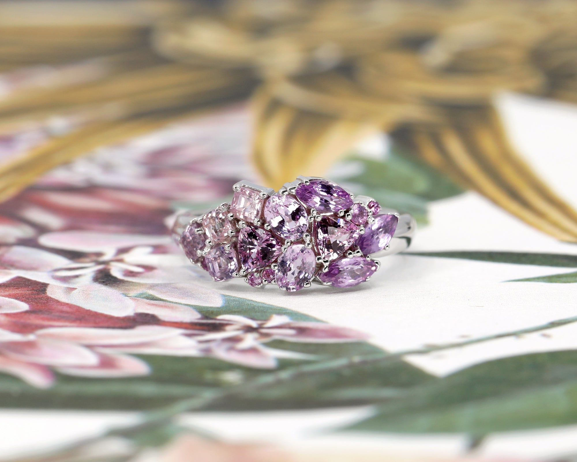 Close-up: Focuses on the sapphires’ natural brilliance and the refined craftsmanship of the yellow gold band. Custom jewelry by Bena Jewelry, Montreal, Canada.