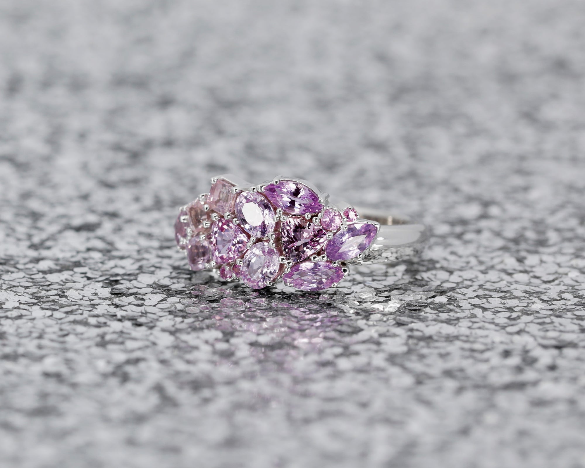 Top-down view: Displays the sapphire arrangement and the seamless integration of the gemstones with the yellow gold. Crafted in Montreal, Canada, by independent designer Bena Jewelry.