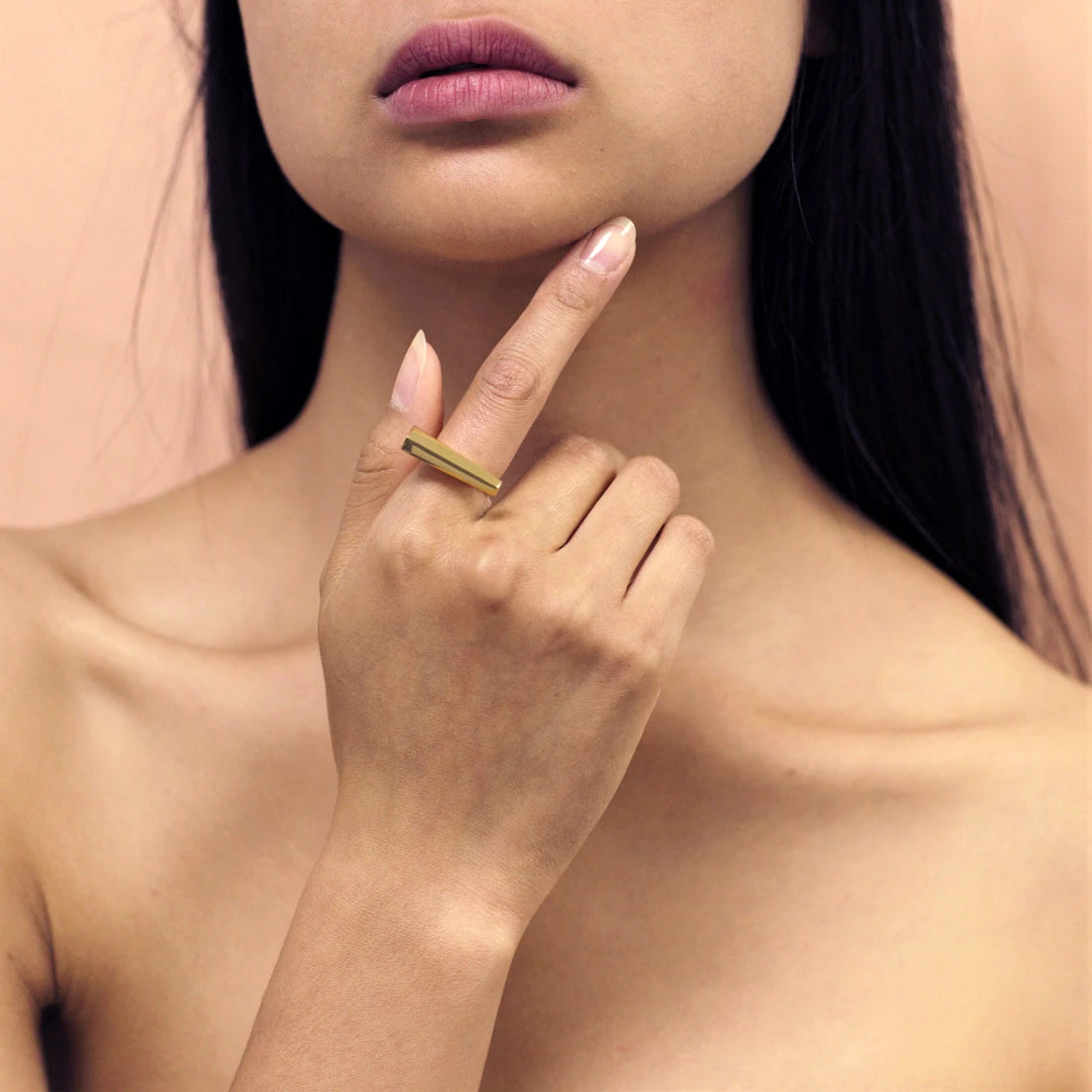 Fashion shot of STURDY RING by Bena Jewelry: a yellow gold statement gender neutral ring. Modern fine jewelry available online at our Montreal jewellery store.