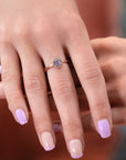 Bena Jewelry rose gold ring featuring an opalescent purple sapphire surrounded by natural champagne diamonds. Contemporary fine jewelry designed and made in Montreal, Canada.