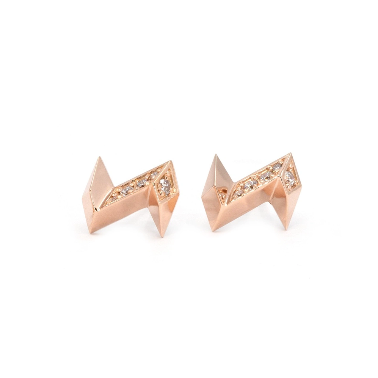 Lightning bolt earrings, front view, in rose gold with laboratory diamonds. This designer jewel is seen here on a white background. The earrings are a creation of independent Canadian brand Bena Jewelry.
