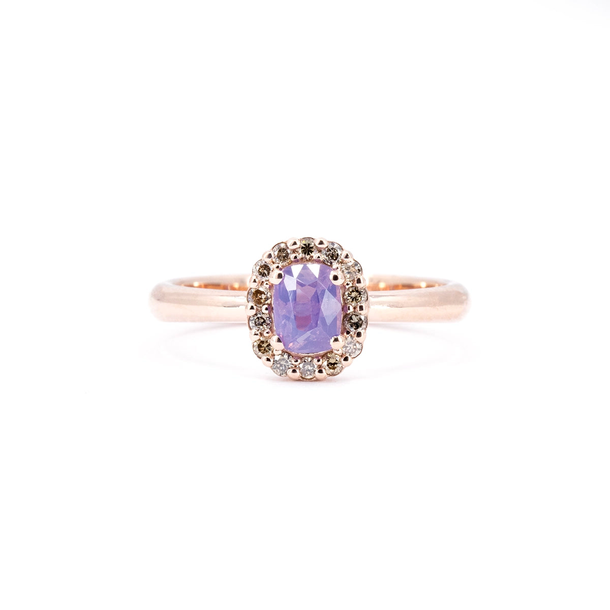 Opalescent purple sapphire ring by Bena Jewelry featuring a natural champagne diamond halo and rose gold setting. Contemporary Canadian fine jewelry handmade in Montreal.