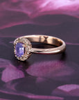 Rose gold halo ring by Bena Jewelry featuring an opalescent lavender sapphire and champagne diamonds. Modern Canadian fine jewelry handcrafted in Montreal.