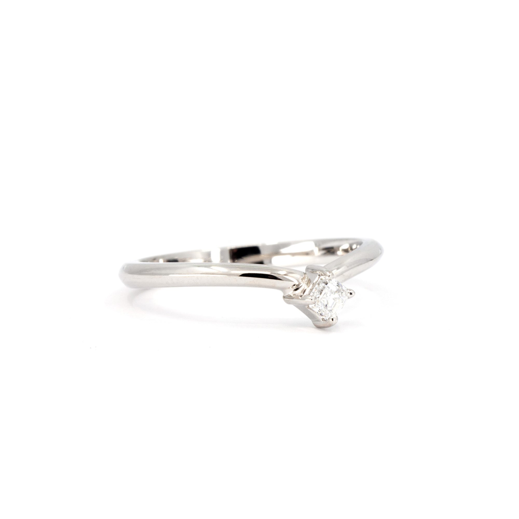 Side view of the white gold ring, emphasizing the Asscher-cut diamond and the subtle curve of the design manufacture in Canada by the designer Bena Jewelry.