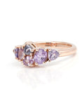 side view of bena jewelry avalanche pink sapphire edgy engagement ring custom made in canada on white background