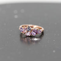 purple and pink sapphire avalanche rose gold designer bena jewelry ring made in montreal on dark background