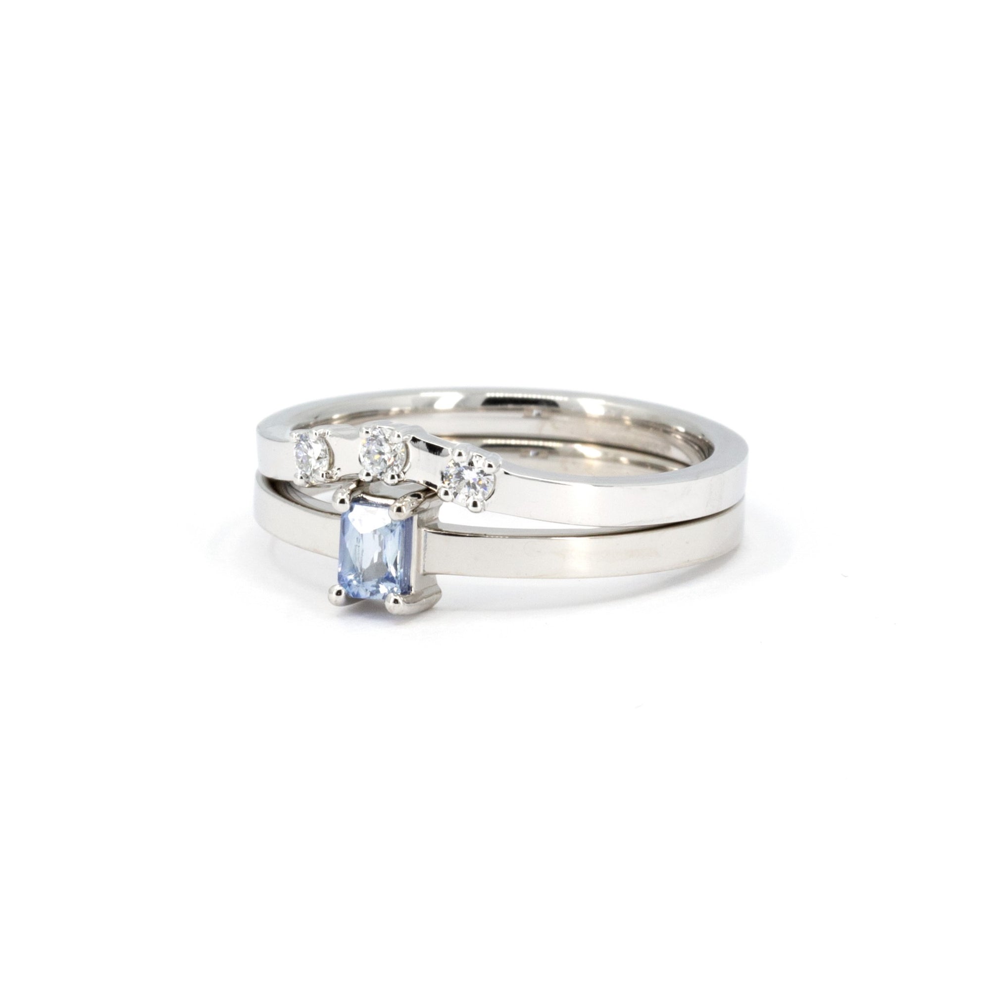 Close-up of the Boxy Minimalist Set, showcasing the sapphire baguette ring and diamond accents on the curved band, handmade by Bena Jewelry.
