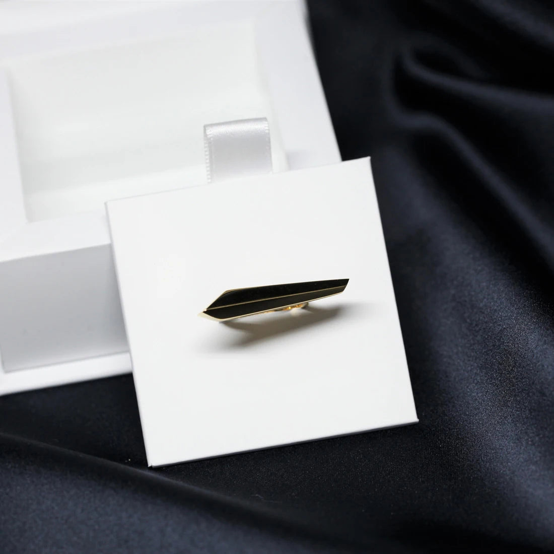 Angled shot of Allure Ring in Yellow Gold – A high-polish gold ring with a strong, modern silhouette, designed by Bena Jewelry.