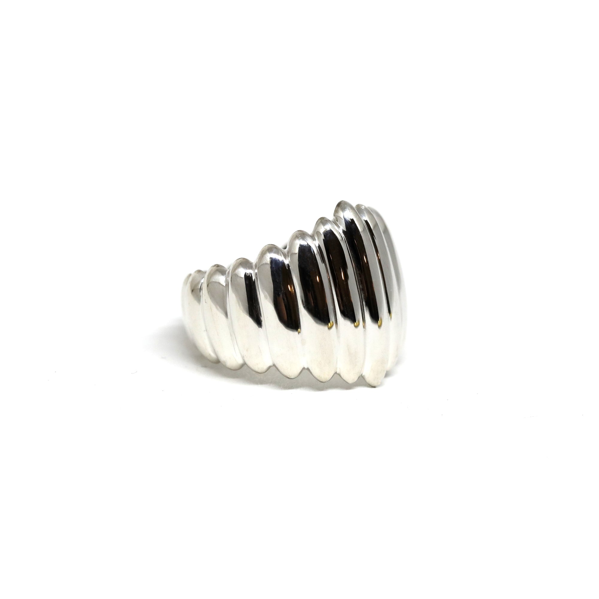 Close-up of Pigalle Ring in White Gold – A statement dome ring with deep grooves and a high-polish finish, blending modernity and bold design.