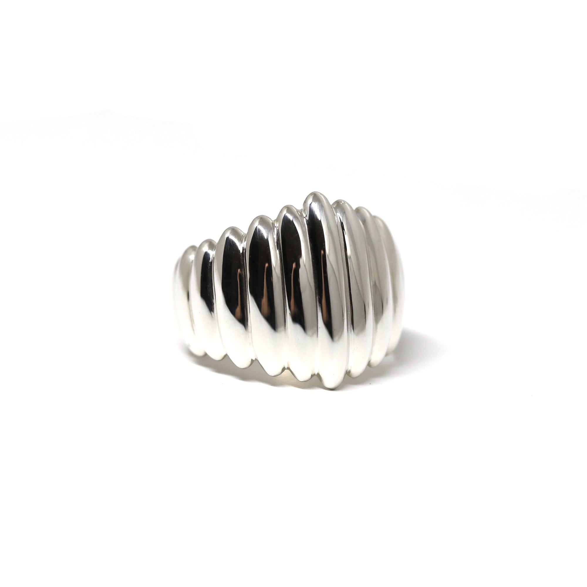 Top-down view of Pigalle Ring in White Gold – A modern and bold statement ring featuring a unique textured surface.