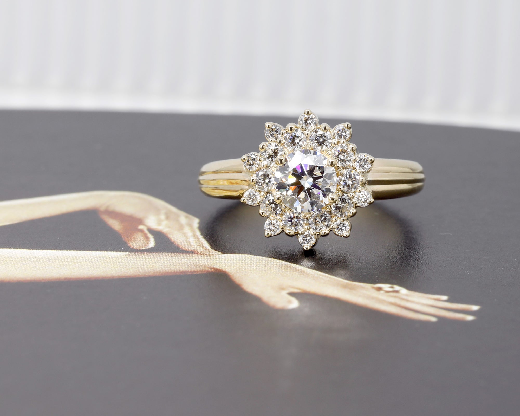 Side view of the Soleil Ring, highlighting the fine detailing of the double halo diamonds, made by Bena Jewelry, Canada.