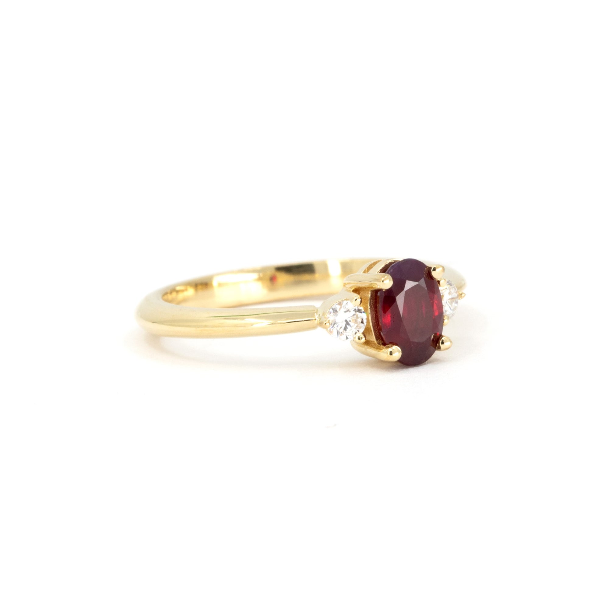 Close-up of Ruby Flame Ring – A deep red ruby with a timeless design, enhanced by sparkling diamonds for a refined look.