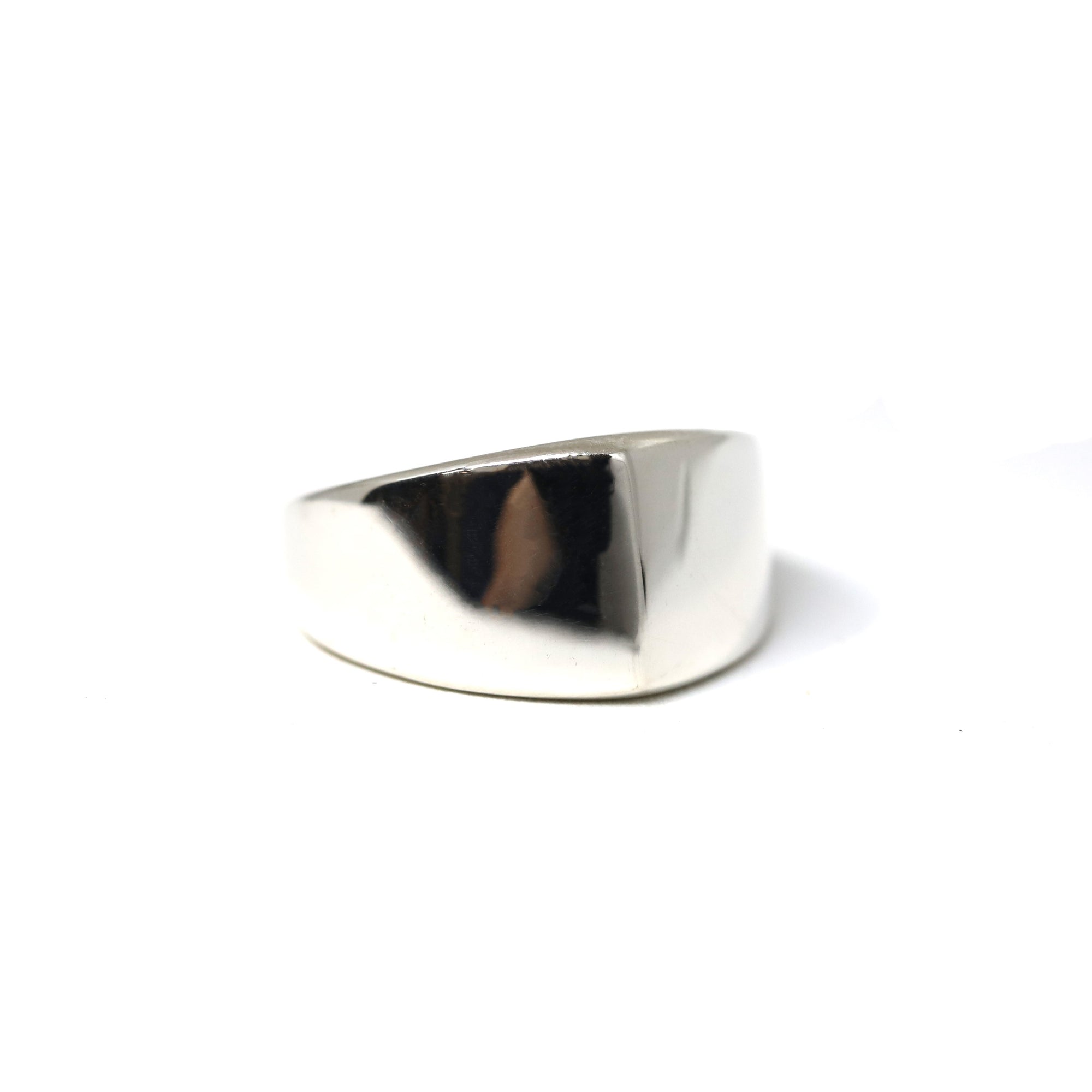 Close-up of Lump Ring in White Gold – A sleek and polished white gold ring with a bold yet understated aesthetic.
