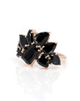 side view of multi shape black gemstone rose gold ring custom made in montreal by bena jewelry designer on white background