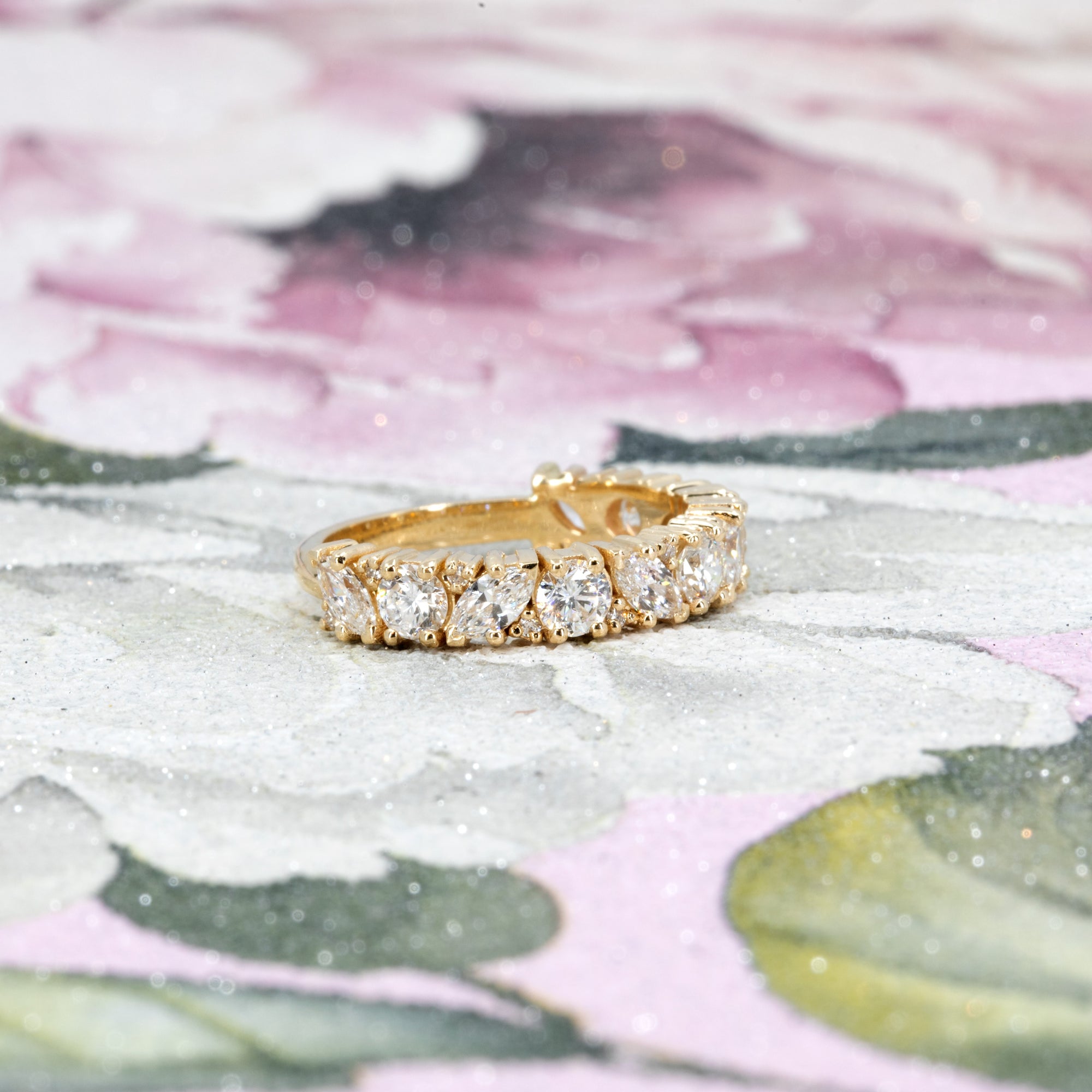  Bena Jewelry present side view of the wedding band, emphasizing the brilliance and symmetry of the marquise and round lab-grown diamonds.