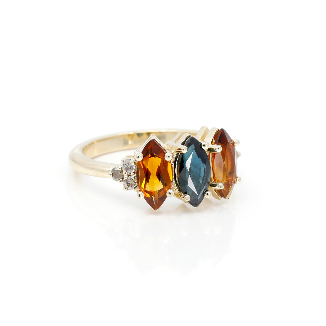side view of marquise shape sapphire and citrine diamond bena jewelry designer ring made in montreal on white background