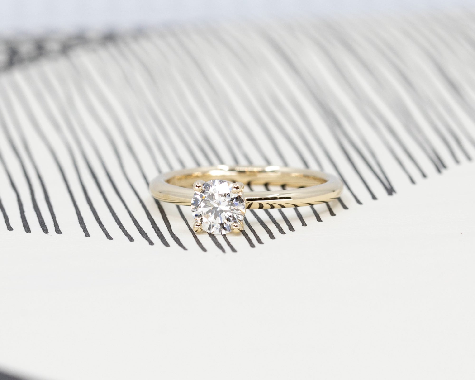Classic white diamond wedding band set on yellow gold. Wedding jewelry made in Montreal.