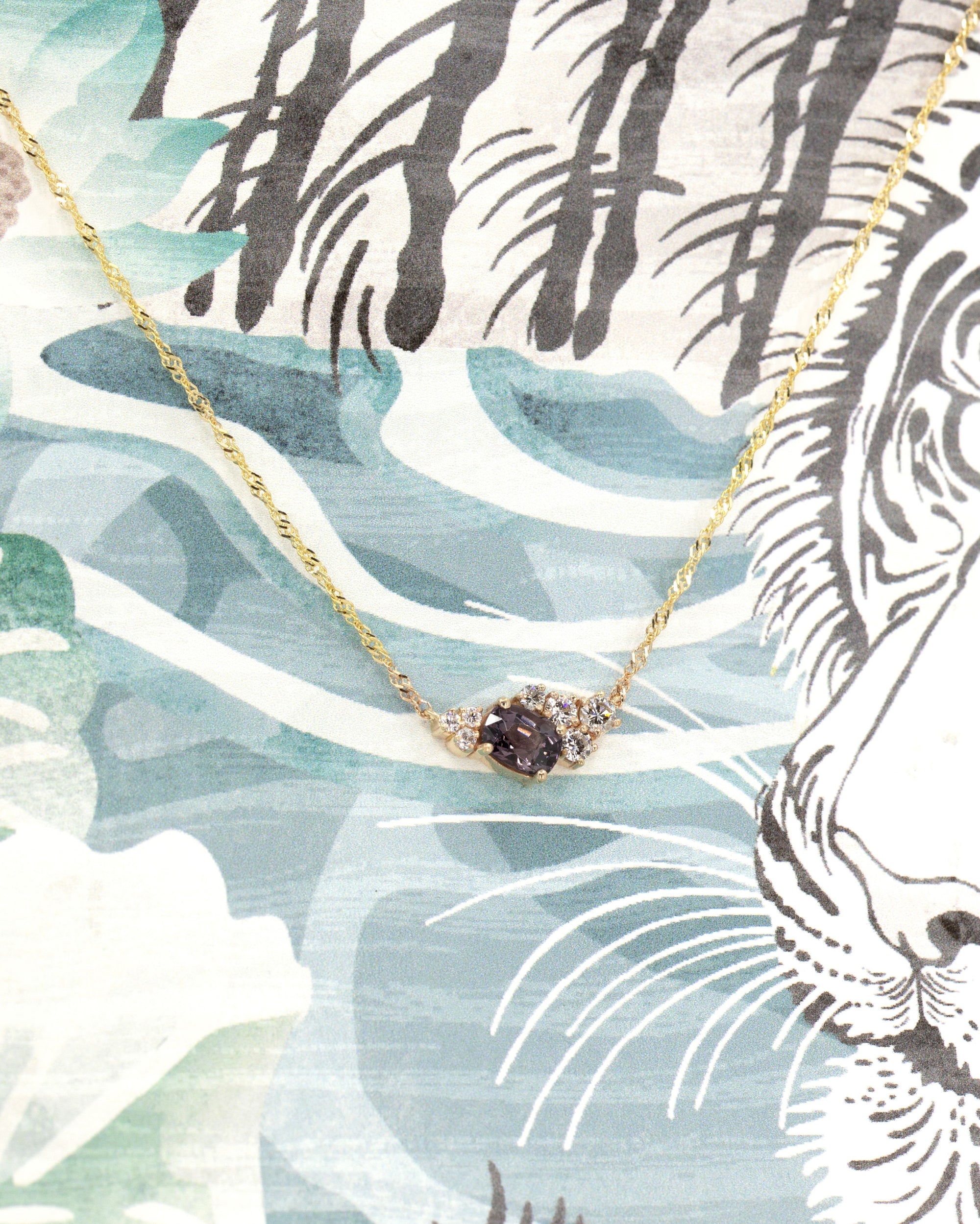 Close-up of the pendant worn, highlighting the asymmetrical design – A contemporary fine jewelry piece that blends structure and fluidity.
