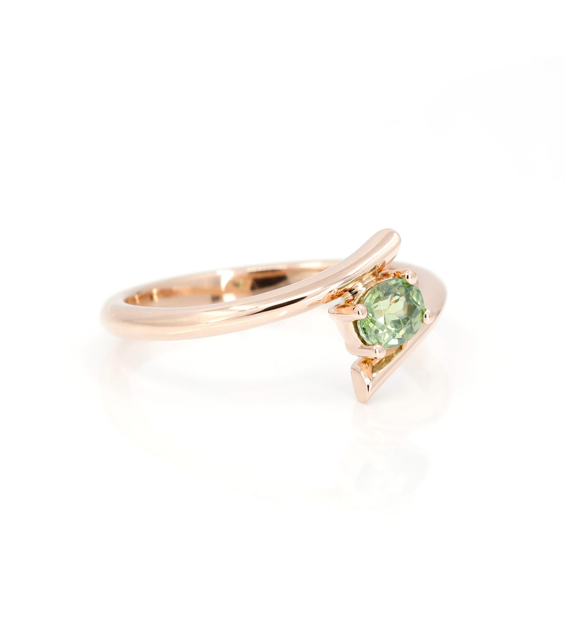 oval shape green demantoid garnet twist ring by bena jewelry montreal on white background