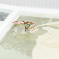bena jewelry custom made bridal ring montreal with green gemstone demantoid garnet on multi color background