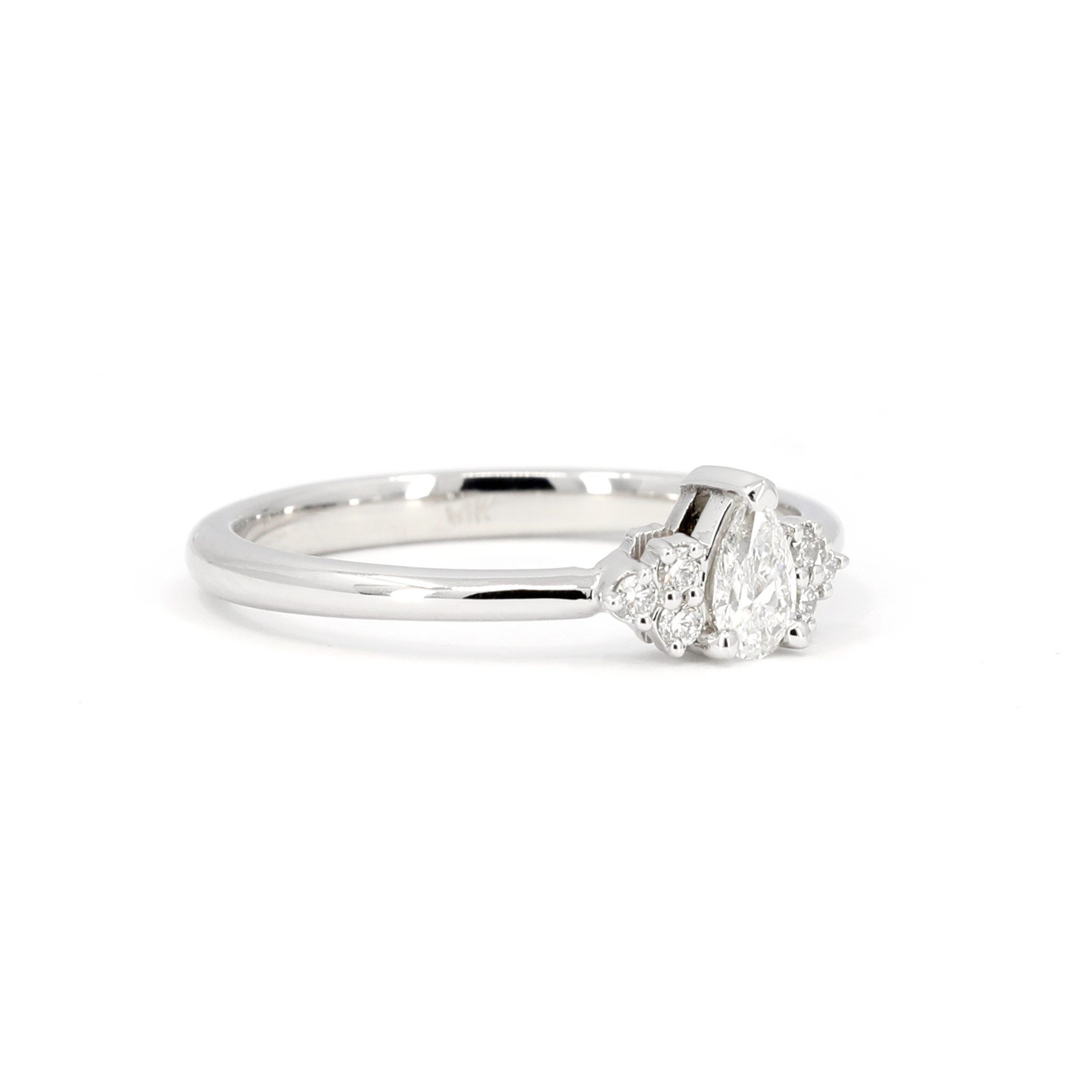 Custom-made pear-shaped diamond engagement ring in white gold, a classic and modern bridal piece handcrafted in Montreal.