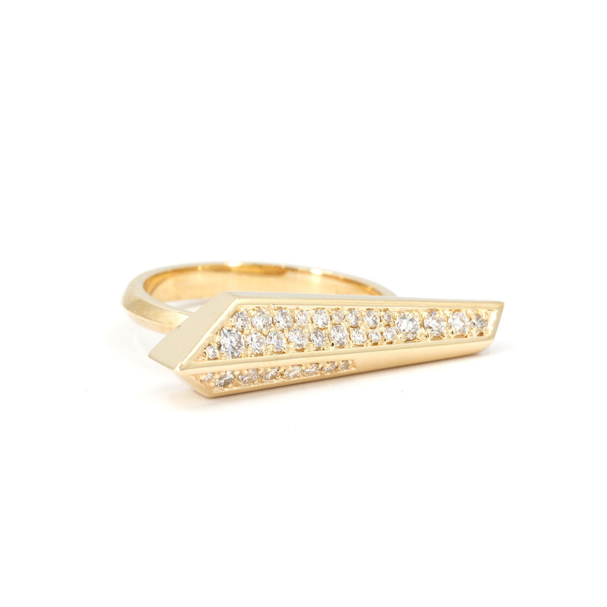 Contemporary diamond ring designed by Bena Jewelry with elongated shape and sculptural silhouette, set in polished yellow gold, on white background.