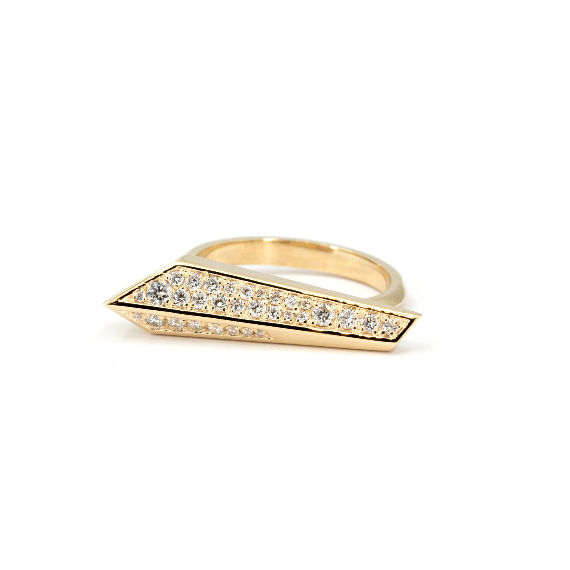 Close-up of edgy gold ring with pavé diamonds, handmade in Montreal by Bena Jewelry, displayed against a minimalist white backdrop.