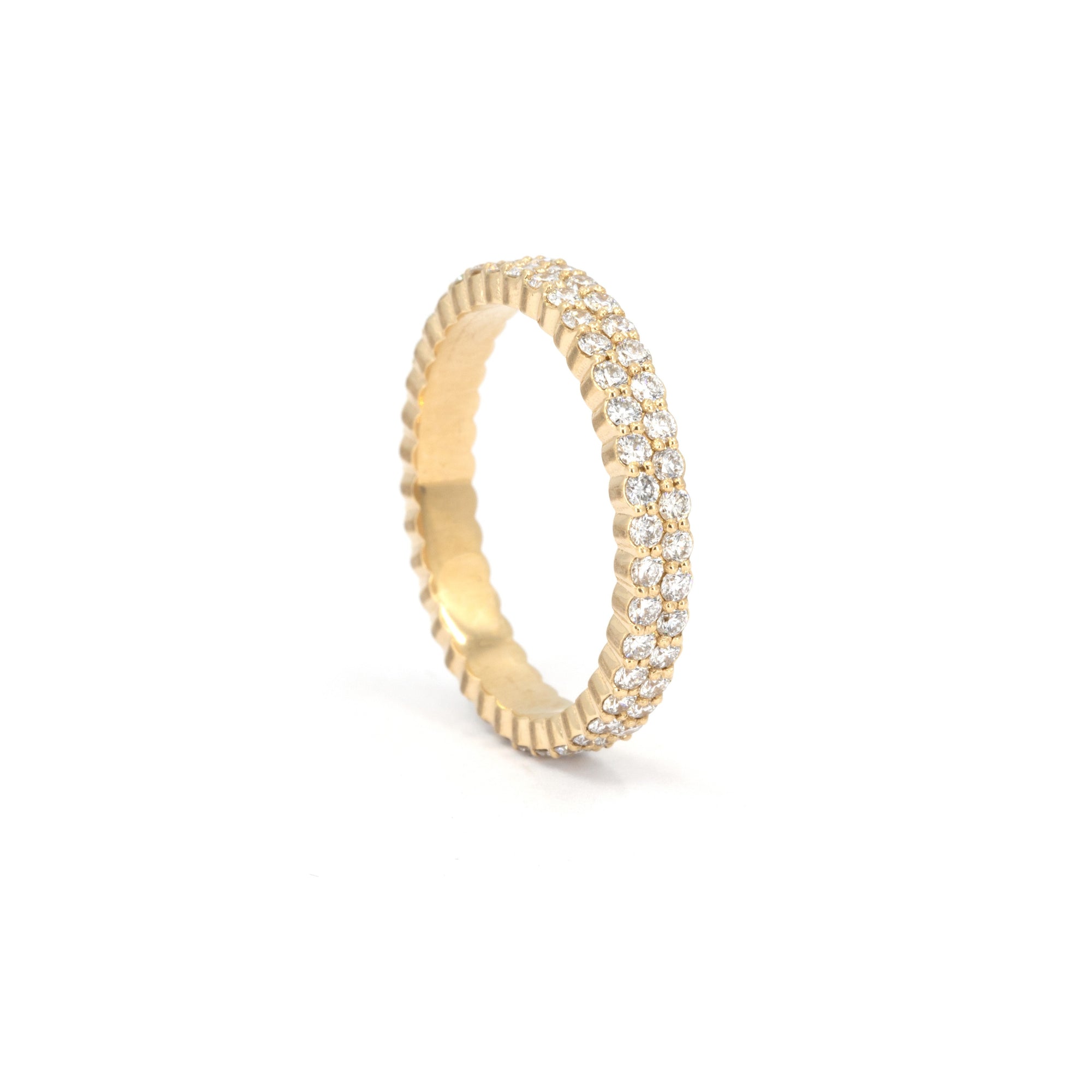 Classic wedding band handcrafted by Bena Jewelry in Montreal, Quebec, featuring two rows of sparkling 1.50 mm diamonds set in 14K yellow gold. Perfect for women seeking bold and timeless luxury jewelry made in Canada